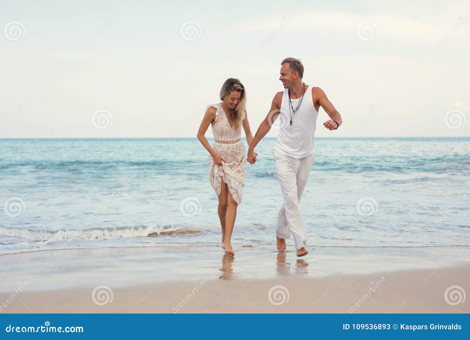 Cheerful Couple In Summer Clothes On The Beach Stock Image Image Of