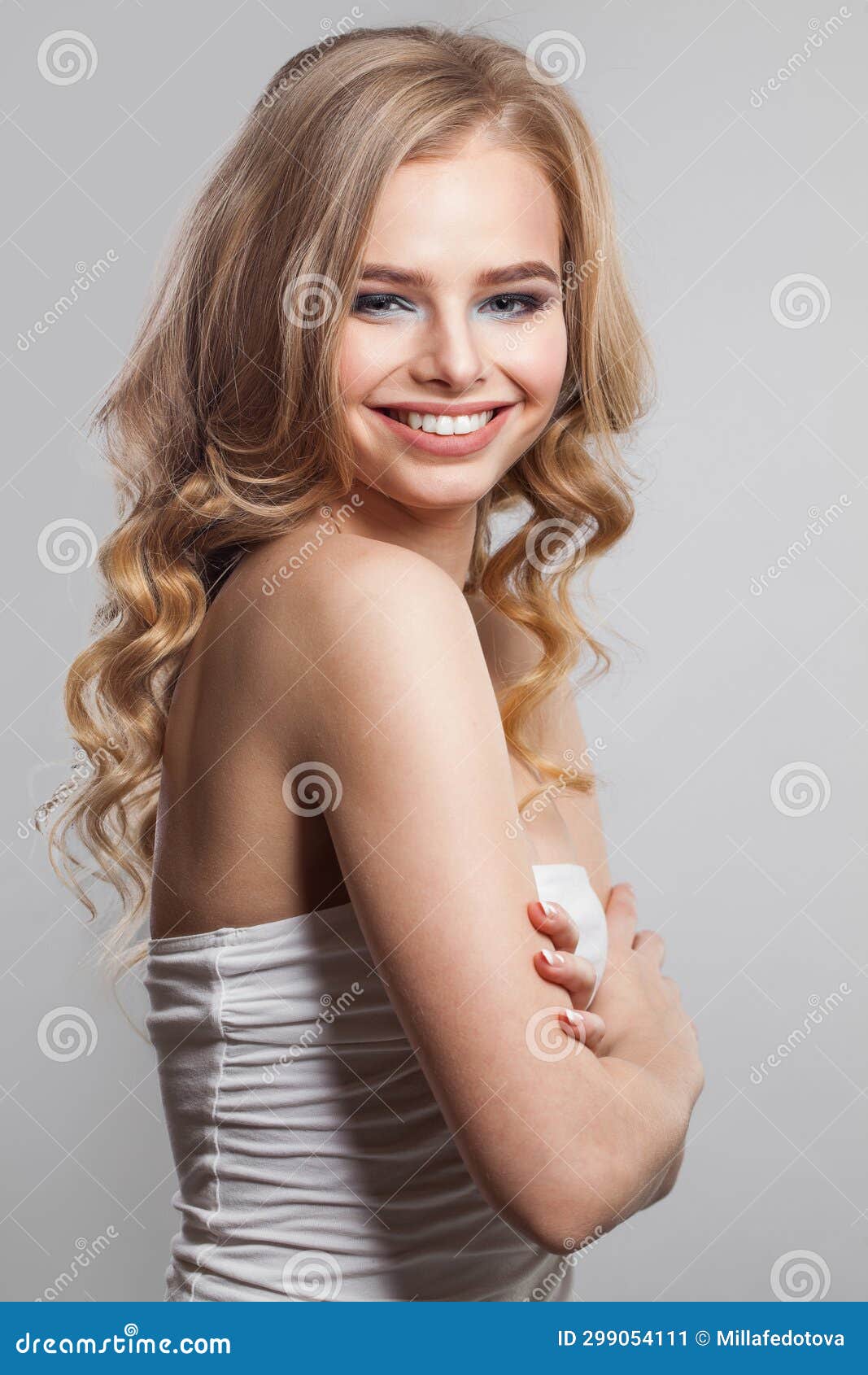 Cheerful Young Female Model Portrait Blonde Woman With Long Wavy Hair Makeup And Clean Skin On 