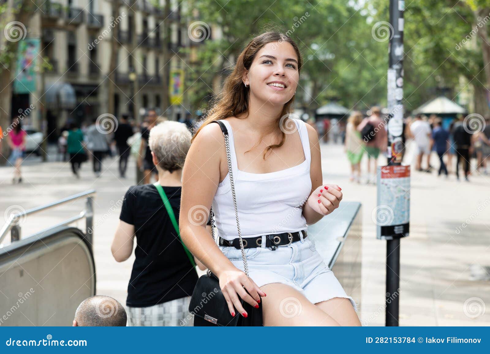 Cheerful Girl Sitting on La Rambla Street during Walk through Summer ...