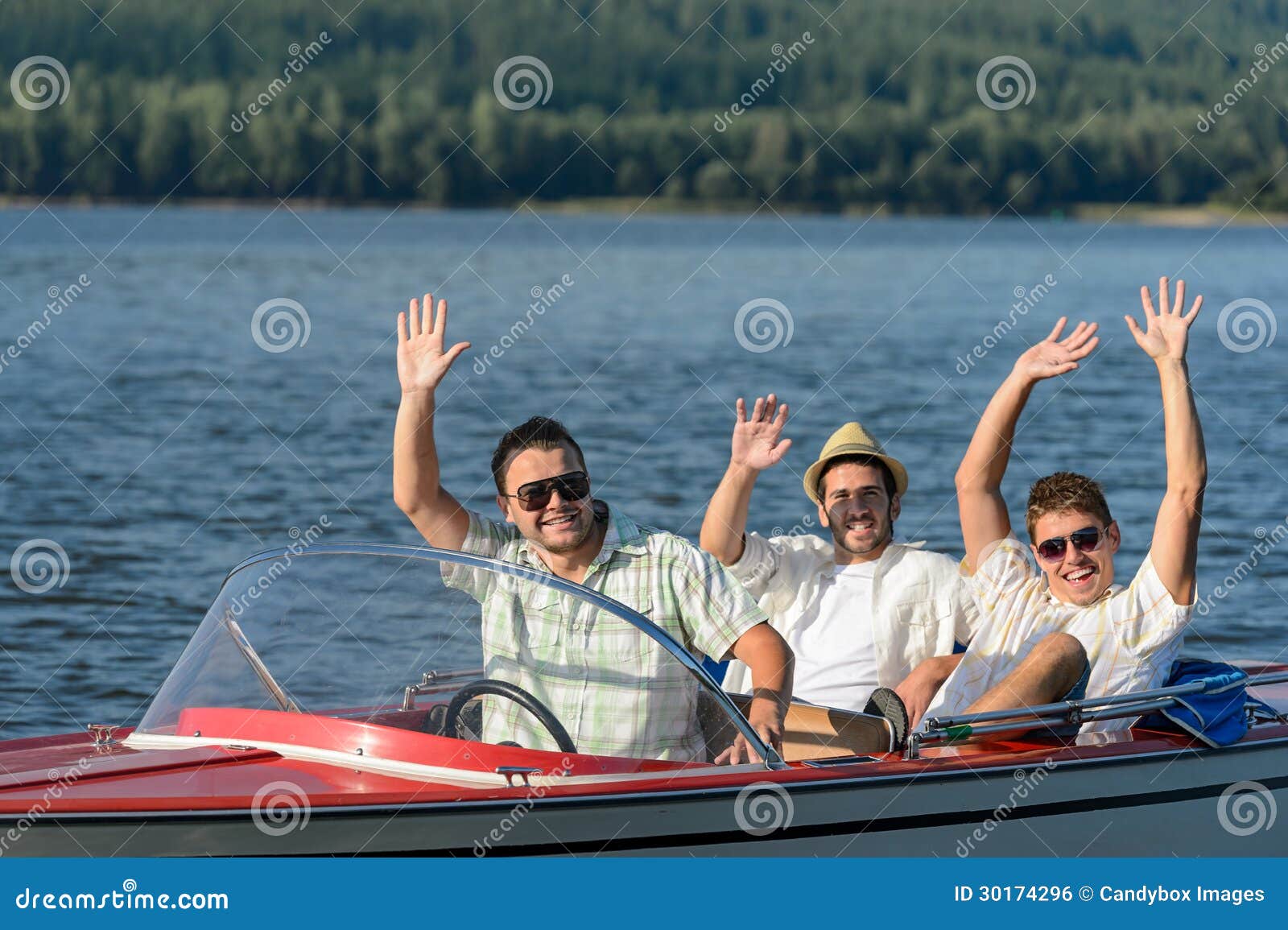 cheerful young guys partying in speed boat