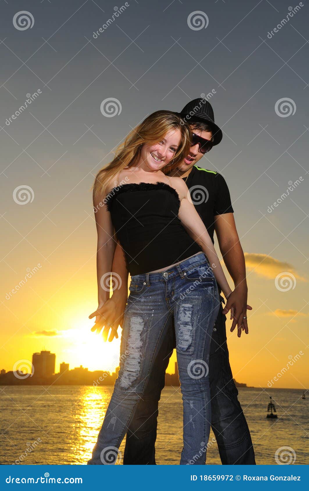 Cheerful Young Latin Couple At Sunset Sto