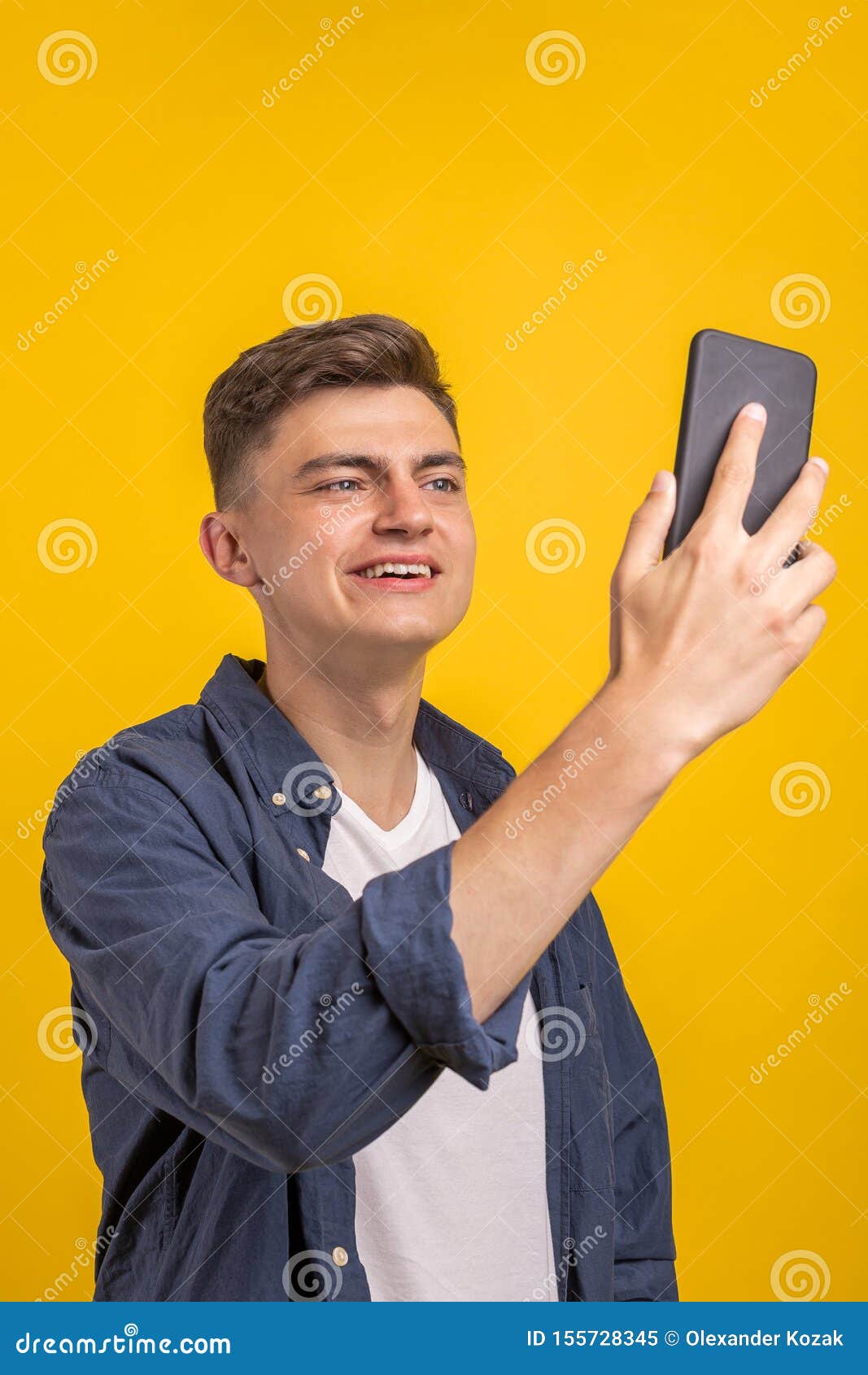 Cheerful Young Man Wearing Plaid Shirt Standing Stock Image - Image of ...