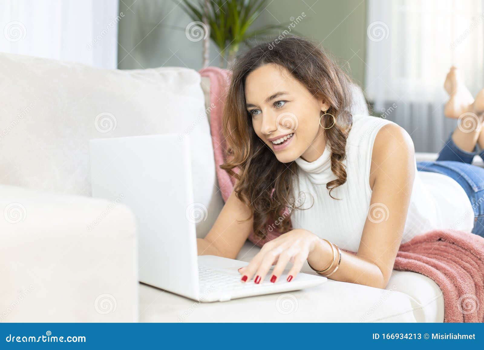 Young Woman Using Laptop on Sofa Stock Image - Image of business ...