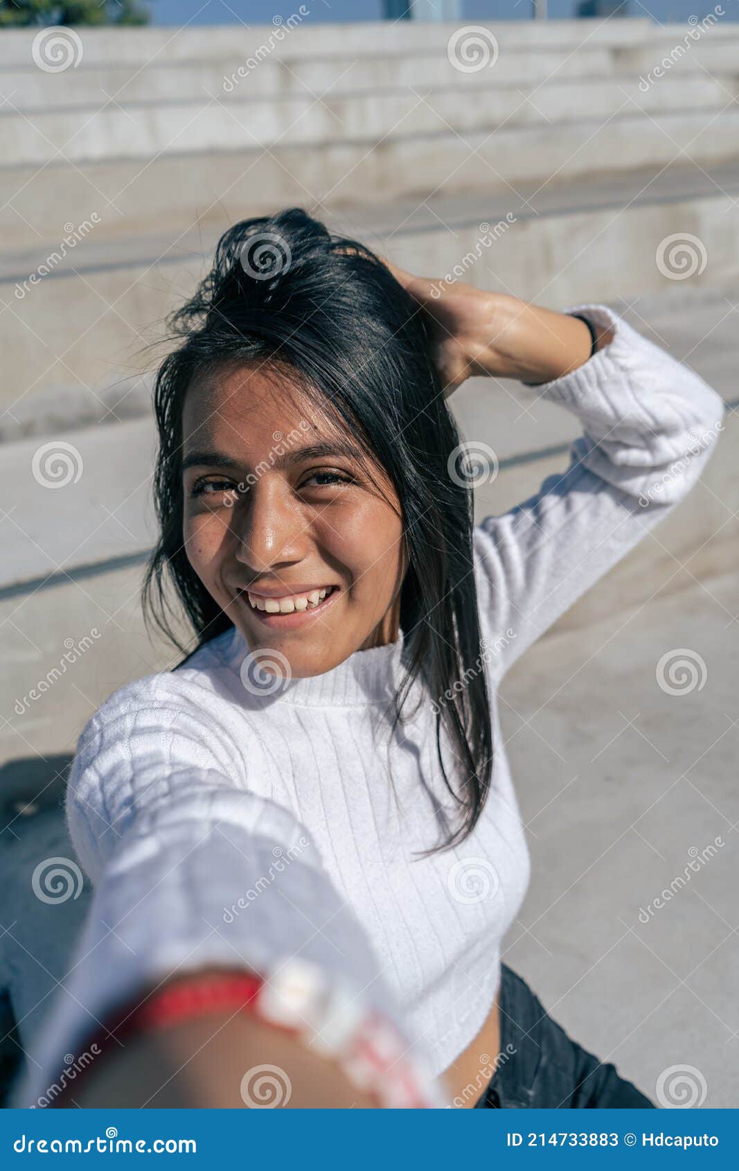 Cheerfull Young Latin Woman Taking A Selfie Or Photograph With Her Smartphone Stock Image 