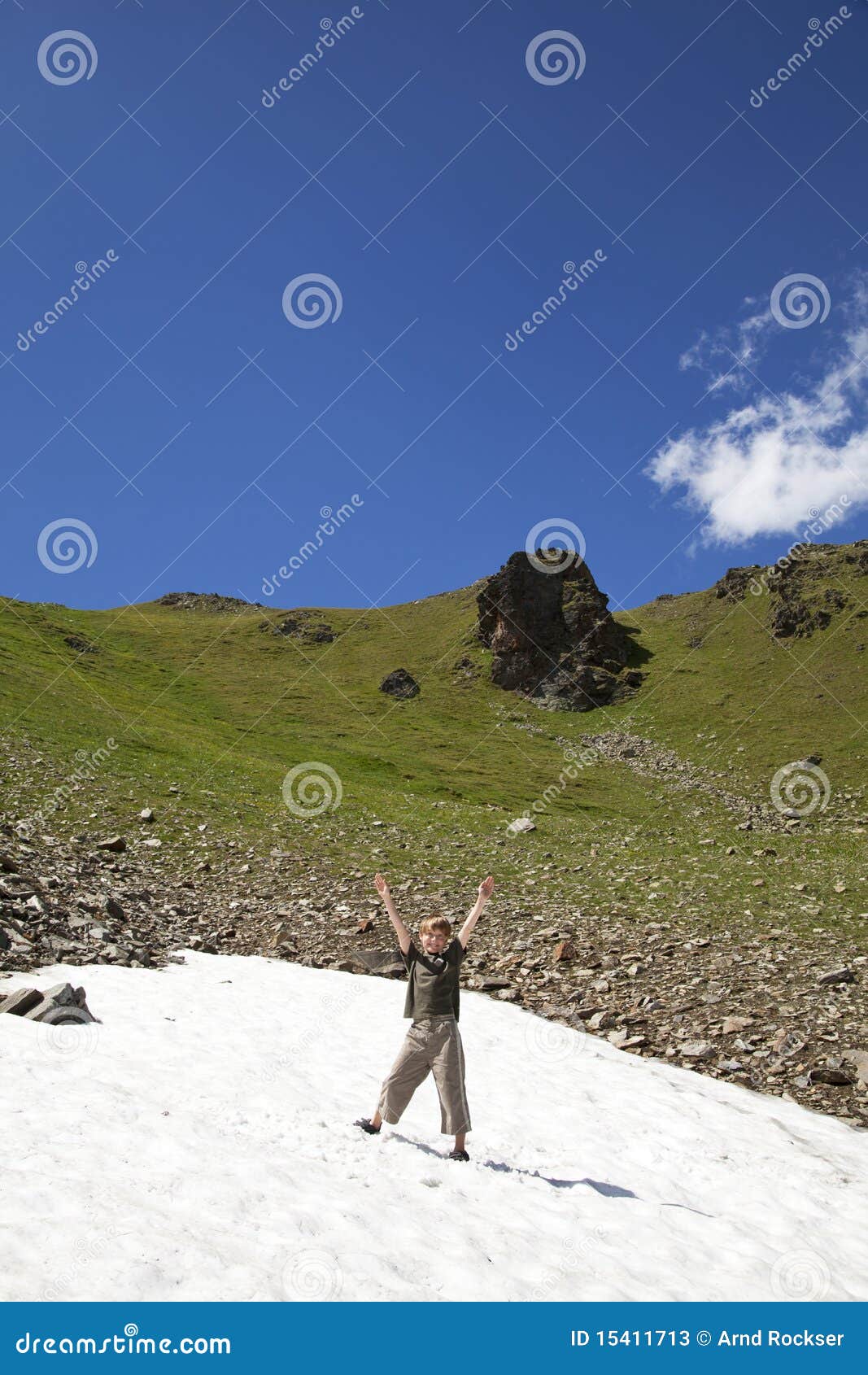 cheering boy in a snowfield