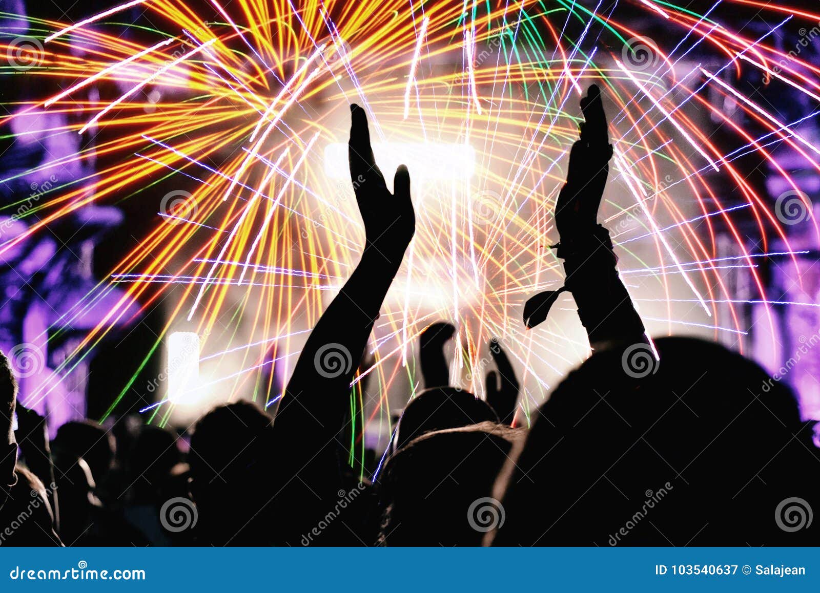 cheering crowd and fireworks. new year`s eve party