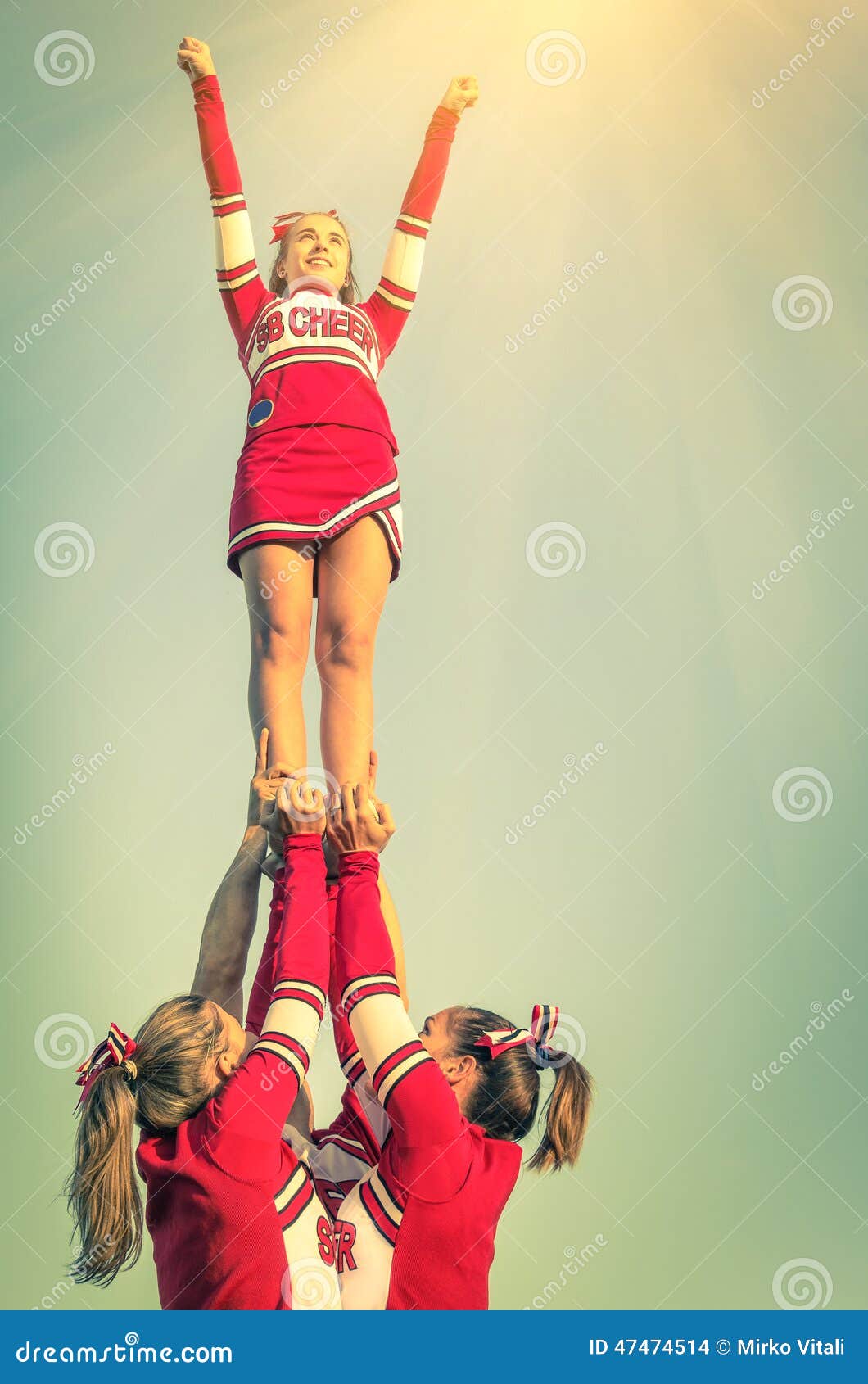 cheerleaders in action on a vintage filtered look