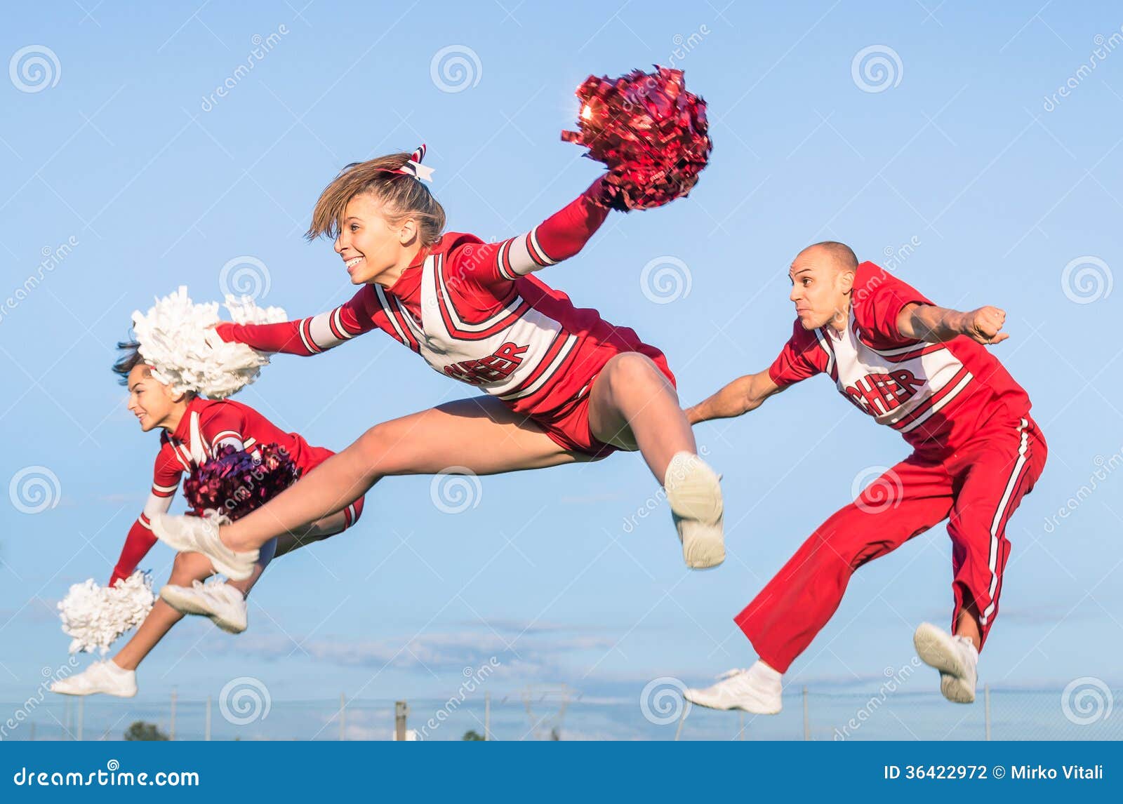 Cheerleaders Team with Male Coach Stock Photo Image of group, happy