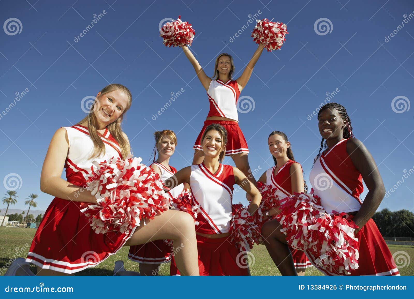 Cheerleading Squad in Formation on Field Stock Photo - Image of