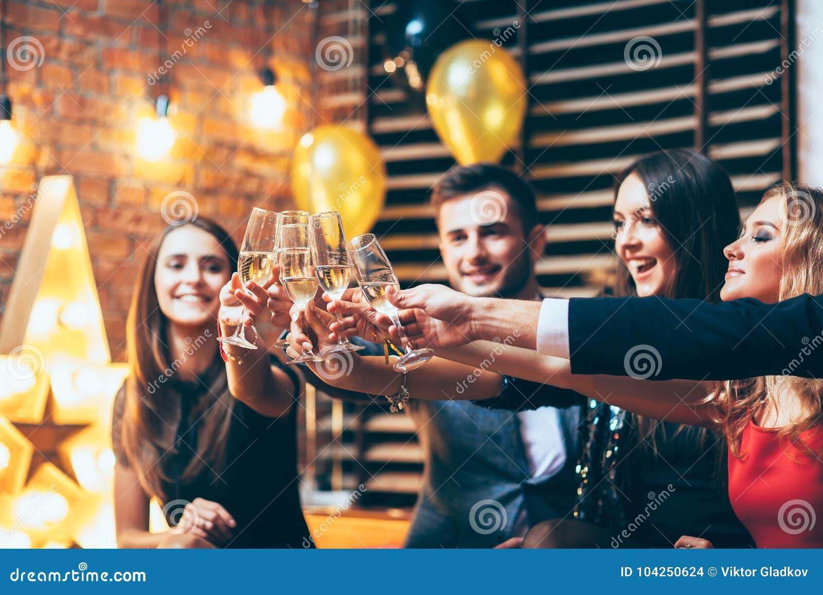cheers! friends with glasses of champagne during party celebration