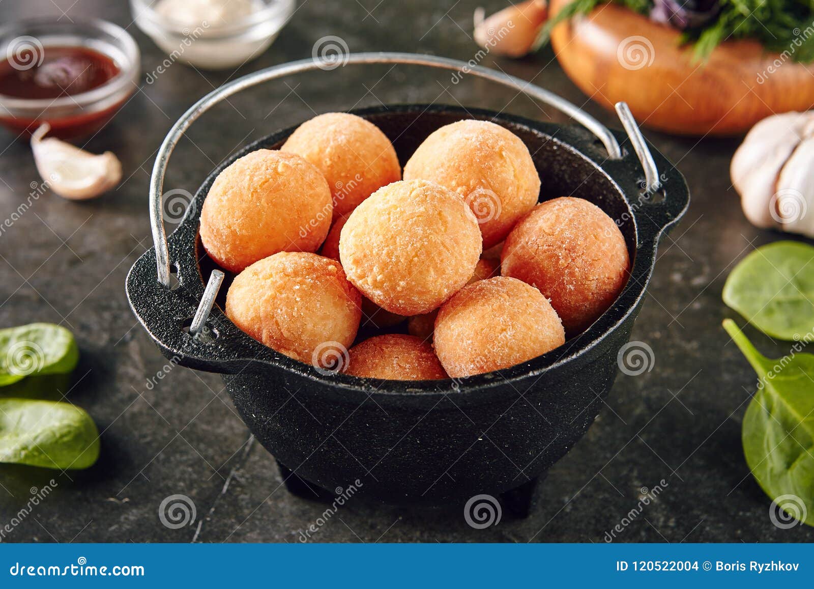cheese balls or chicken croquettes on rustic backdrop