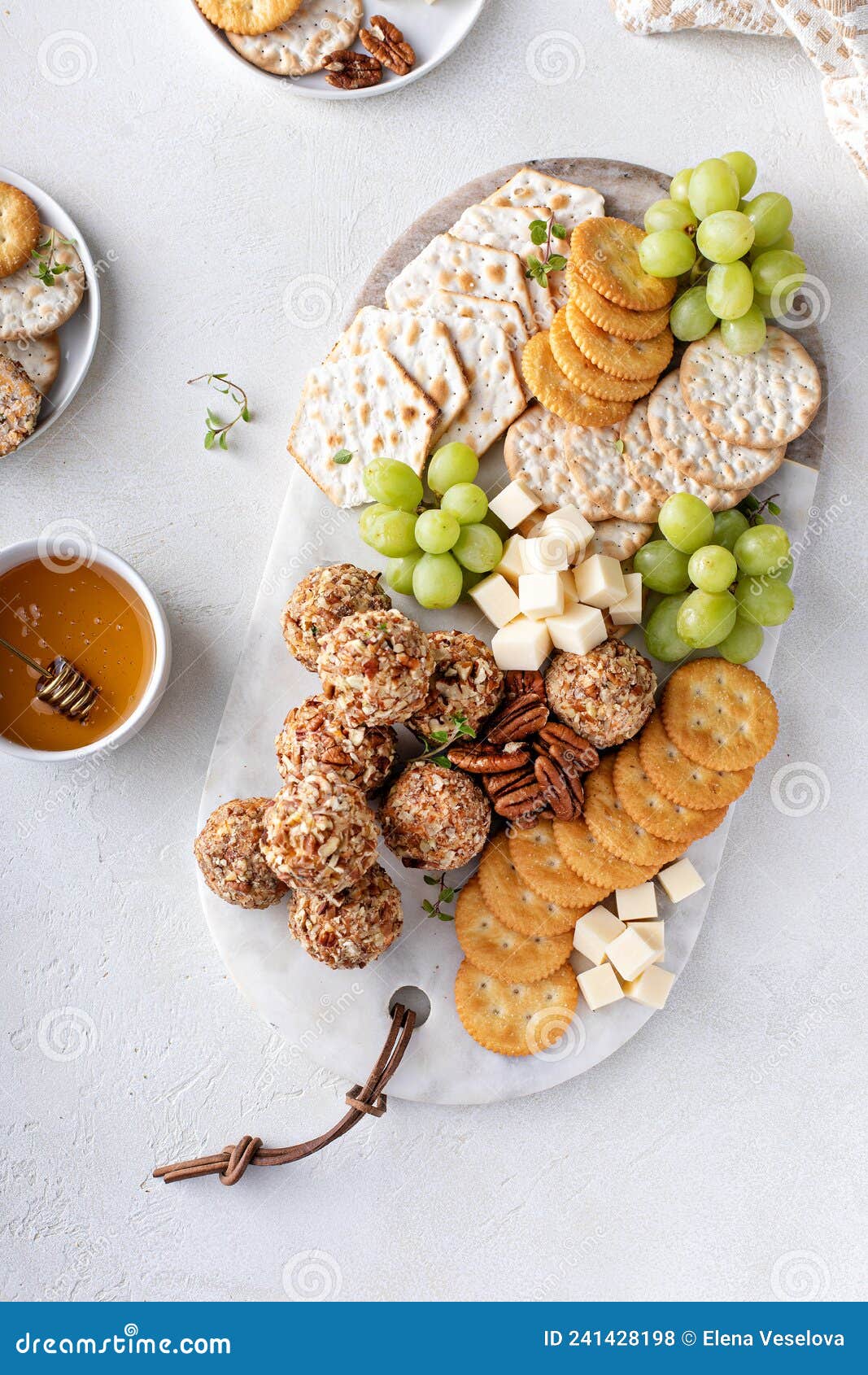 Cheese Balls or Truffles on a Cheese Board with Crackers Stock Photo