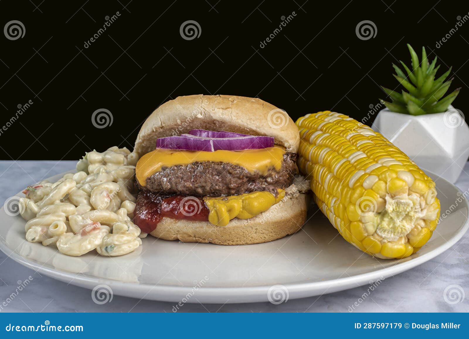 Cheese Burger with Corn and Macaroni Salad Stock Image Image of table