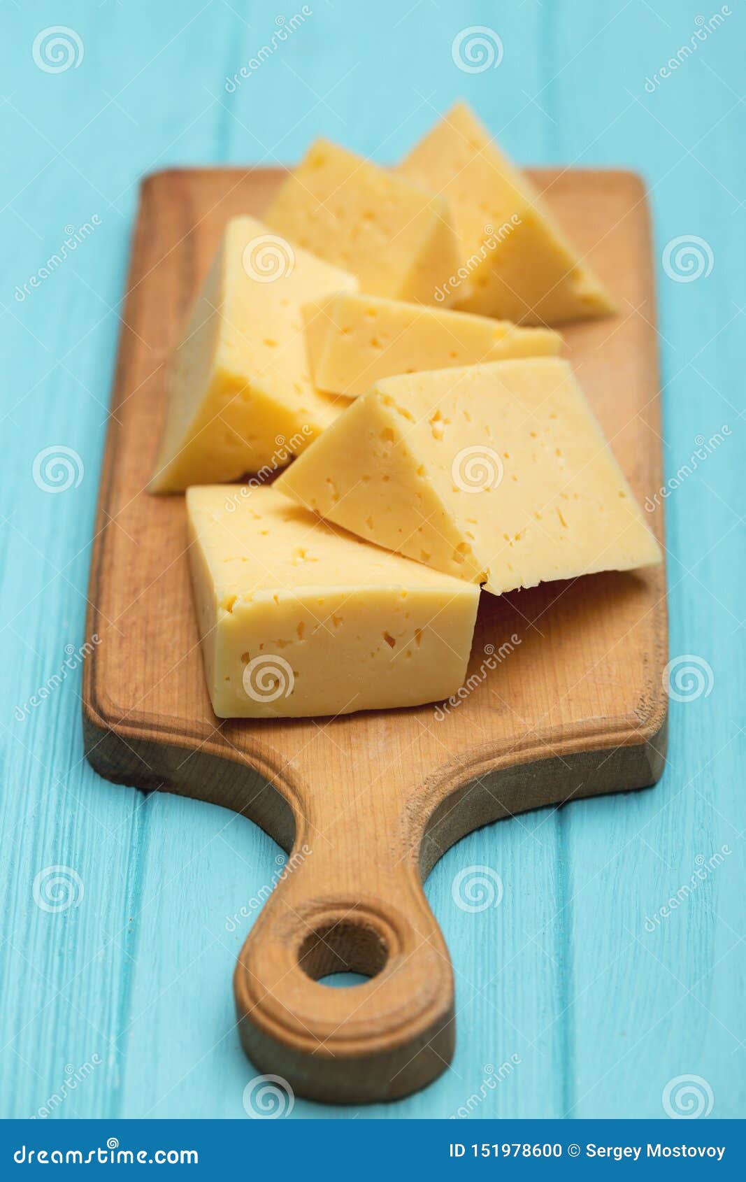 Cheese on a cutting board stock photo. Image of salad 151978600