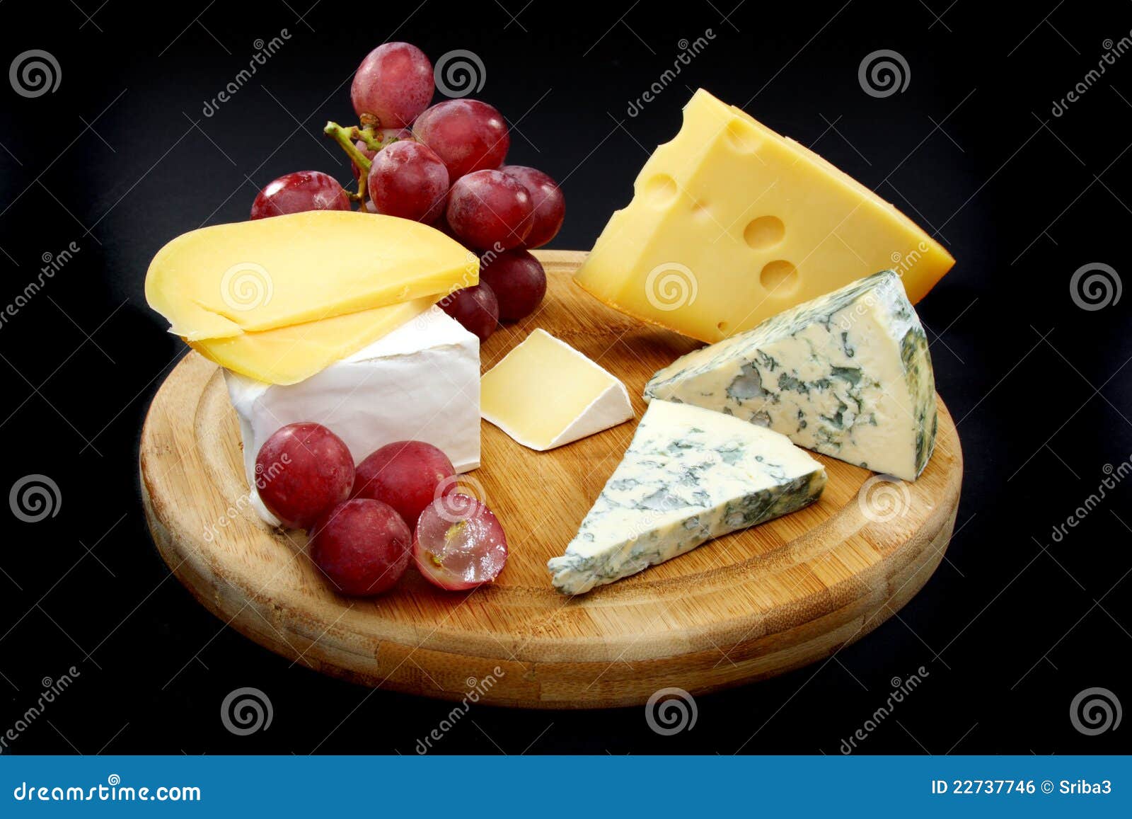 Cheese and Grapes on a Wooden Board. Stock Photo Image of variation