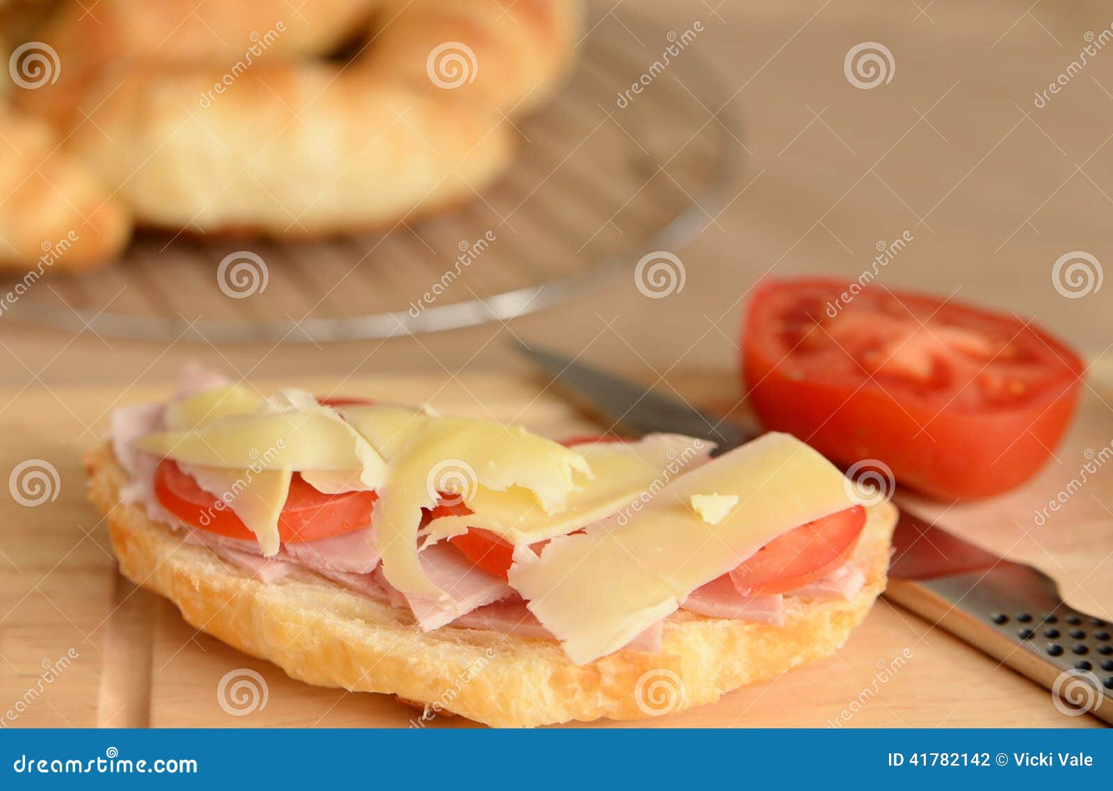 Cheese, Ham and Tomato Topped Croissant. Stock Photo Image of cheese