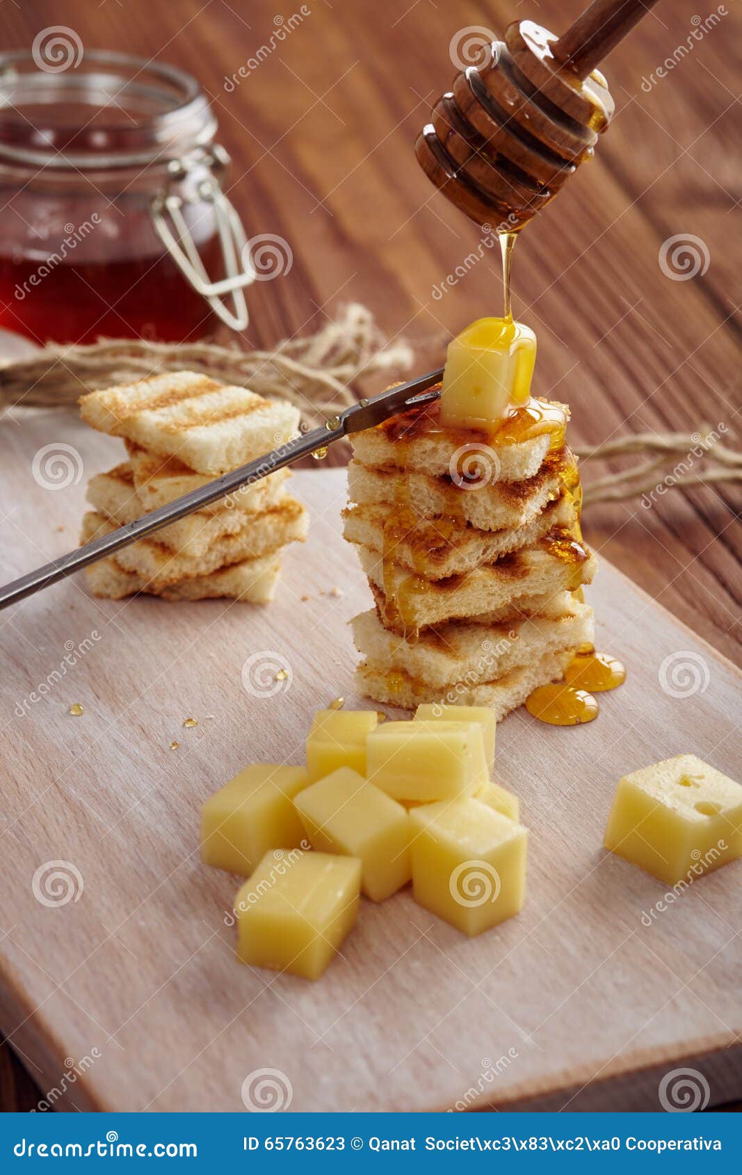 Cheese and honey appetizer stock image. Image of dish 65763623