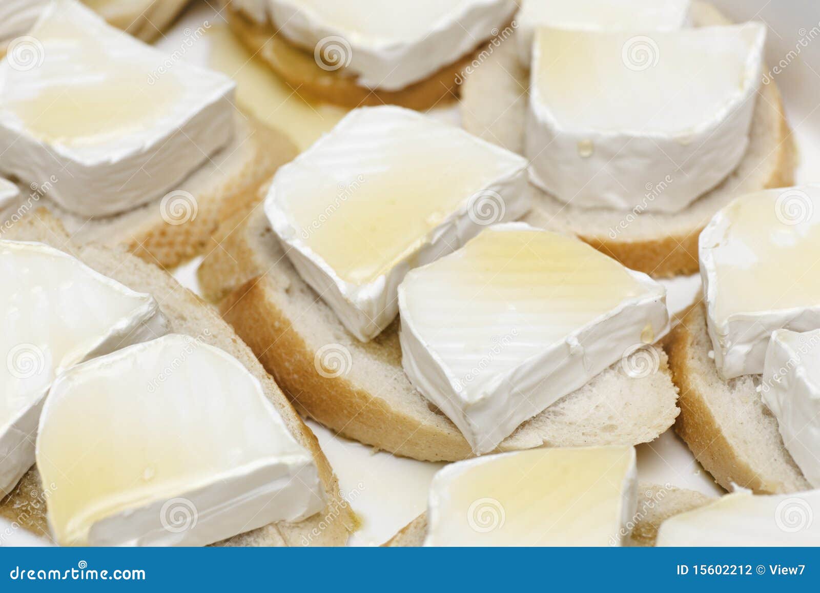 Cheese, honey and bread stock photo. Image of slices 15602212