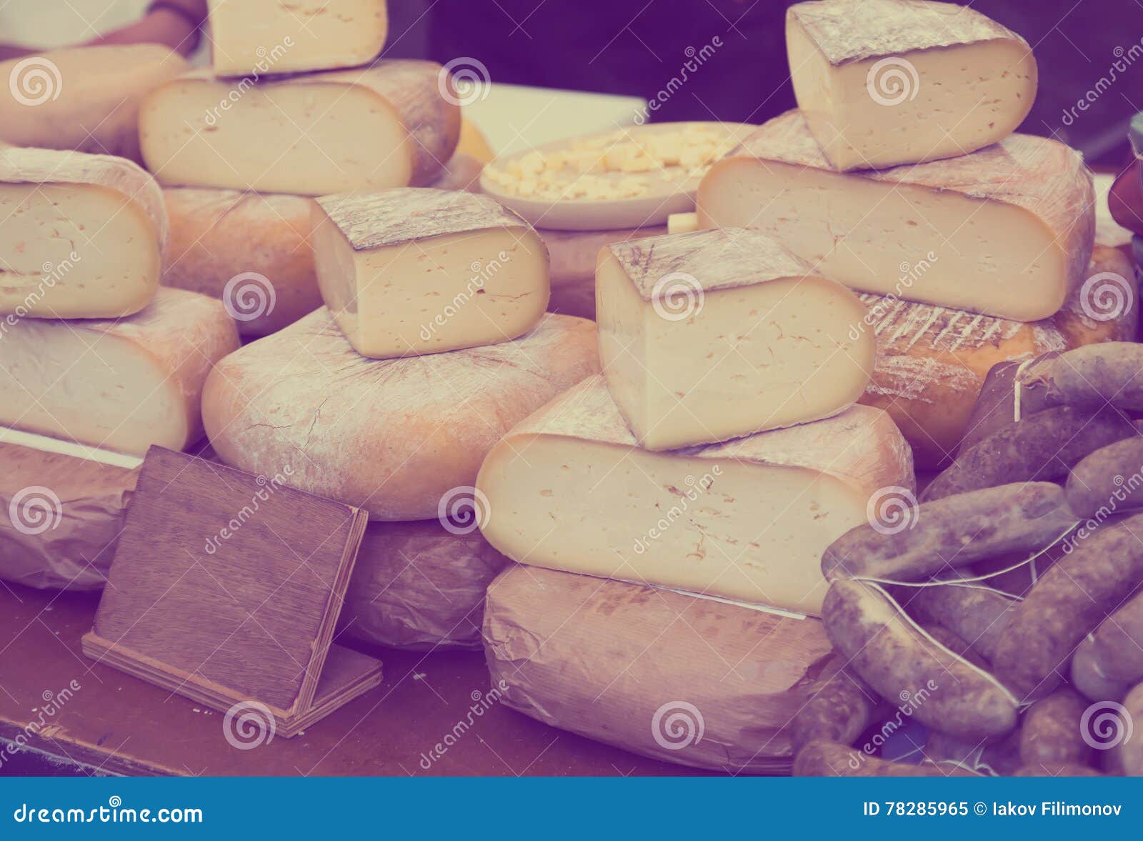 Cheese on market counter stock image. Image of price 78285965