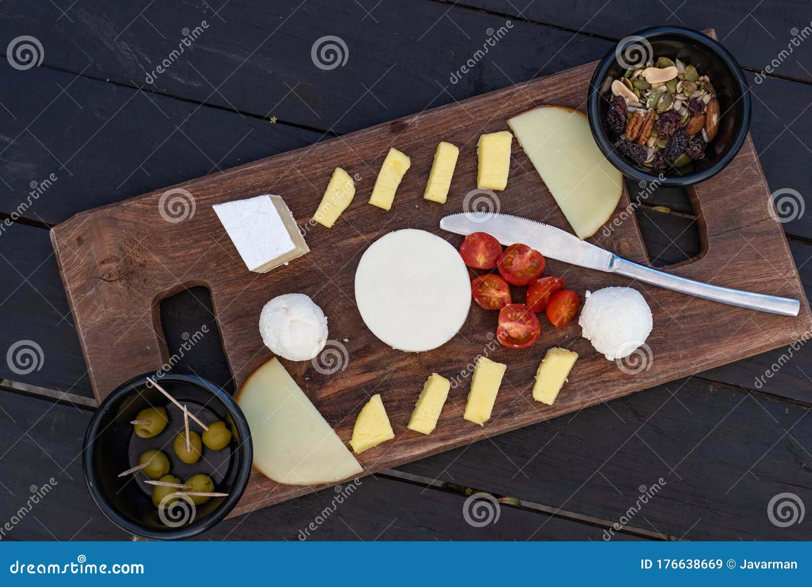 Cheese Plate. Assortment of Various Cheese with Nuts and Olives Stock