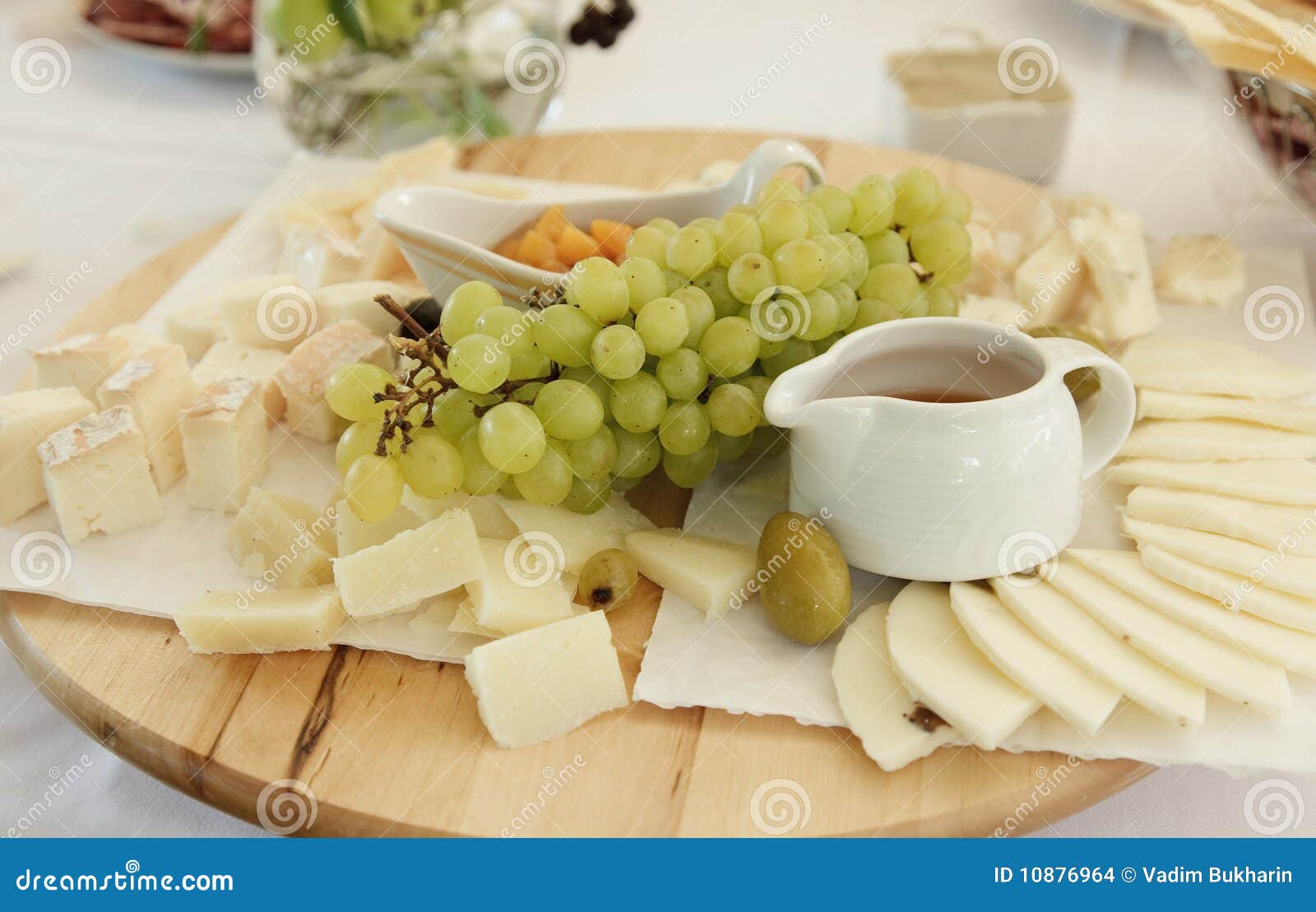 Cheese plate with grapes stock photo. Image of grapes 10876964