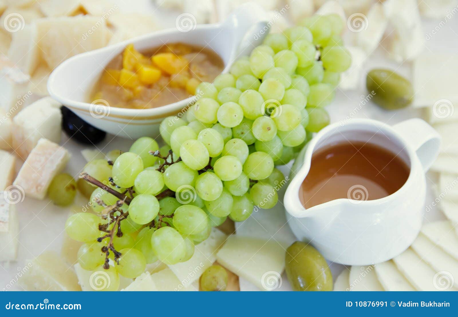Cheese plate with grapes stock image. Image of brunch 10876991