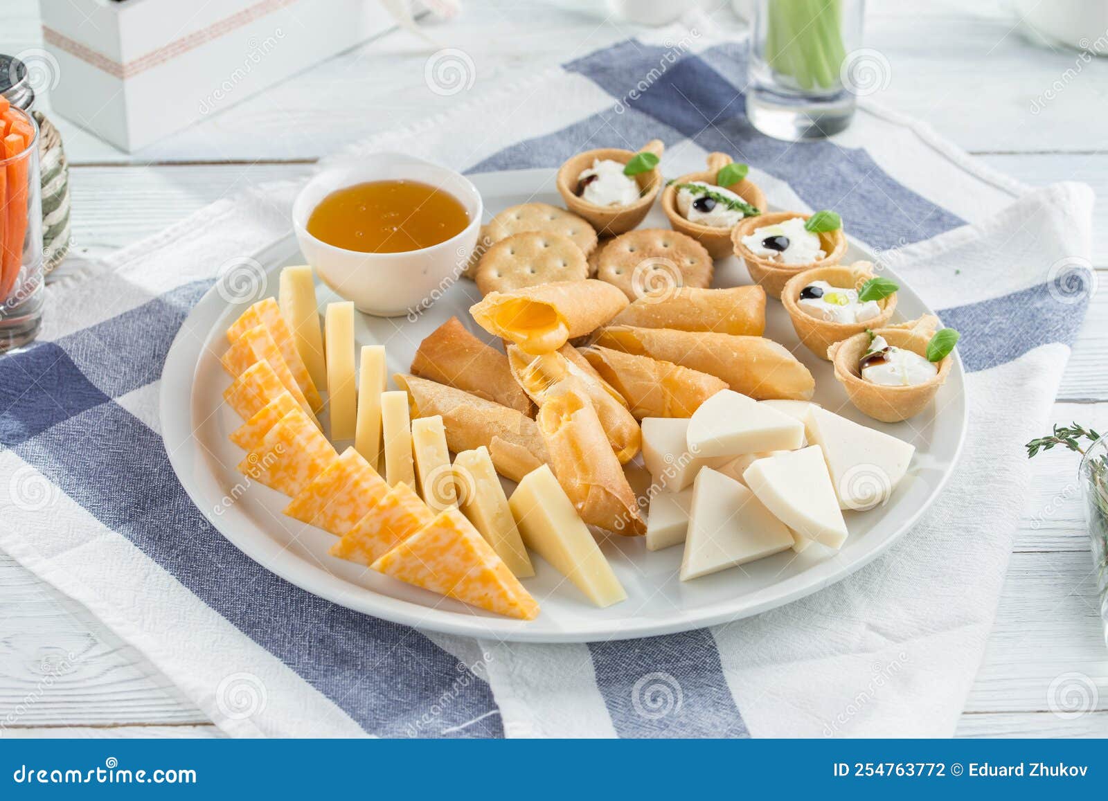 Cheese Platter with Different Cheese and Honey Festive Gourmet