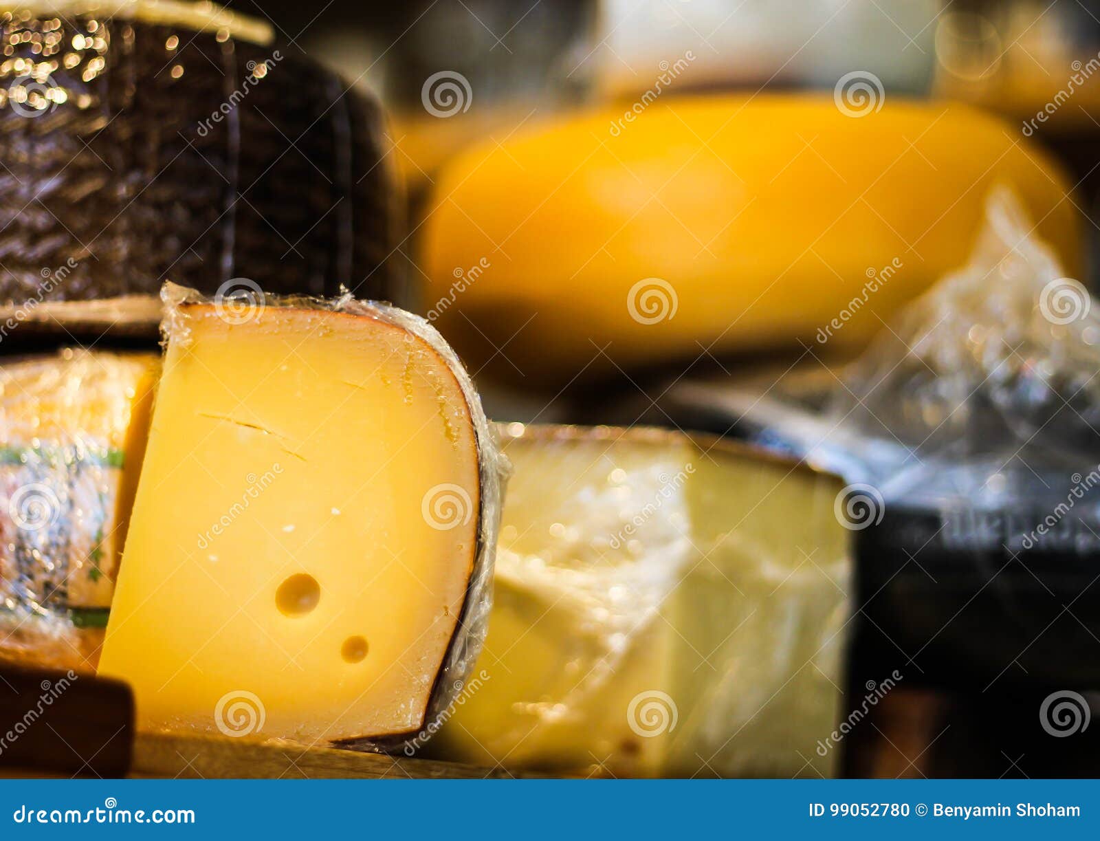 Cheese Wheels Stacked at the Deli Stock Photo - Image of restaurant