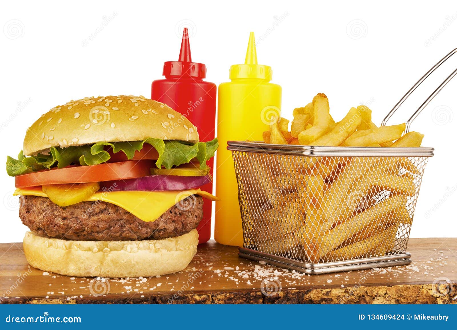 Cheeseburger With French Fries Basket Ketchup And Mustard Bottles