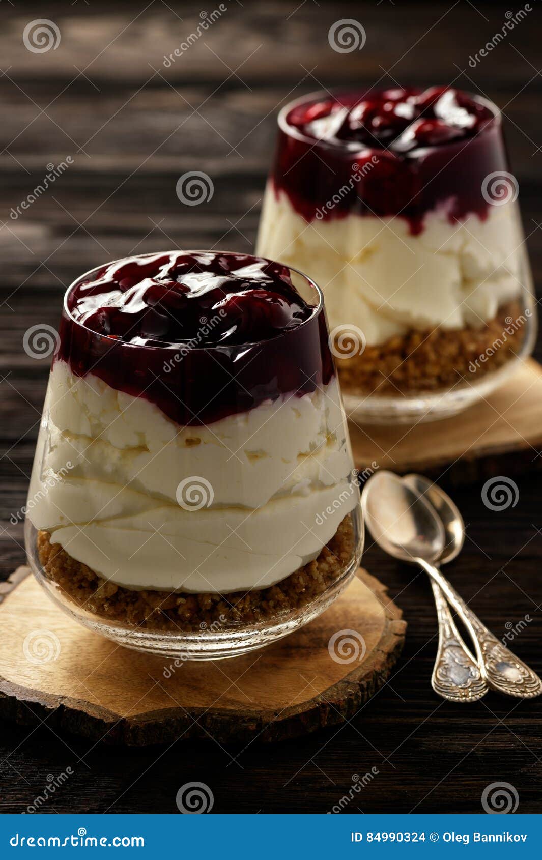 Cheesecake with Cherry Jelly in Glass Jars. Stock Photo Image of