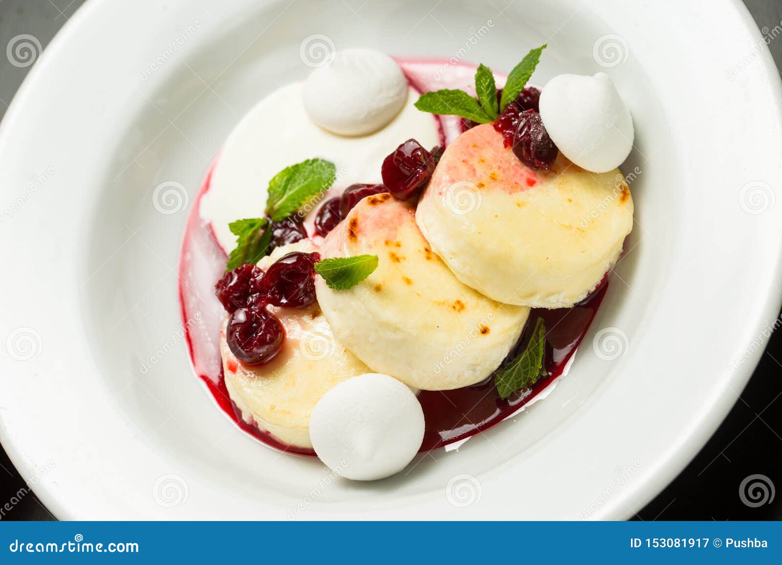 Cheesecakes with Fruit Sauce on a Plate Stock Image Image of food