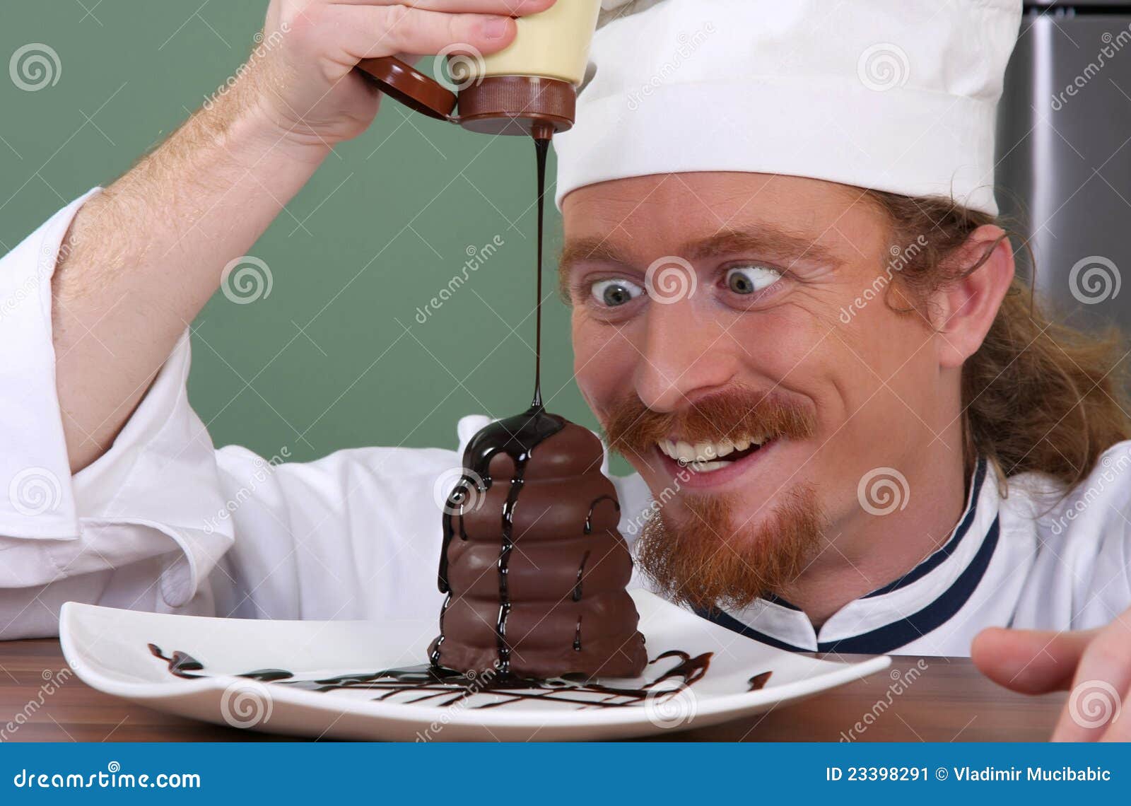 chef added chocolate sauce at piece of cake