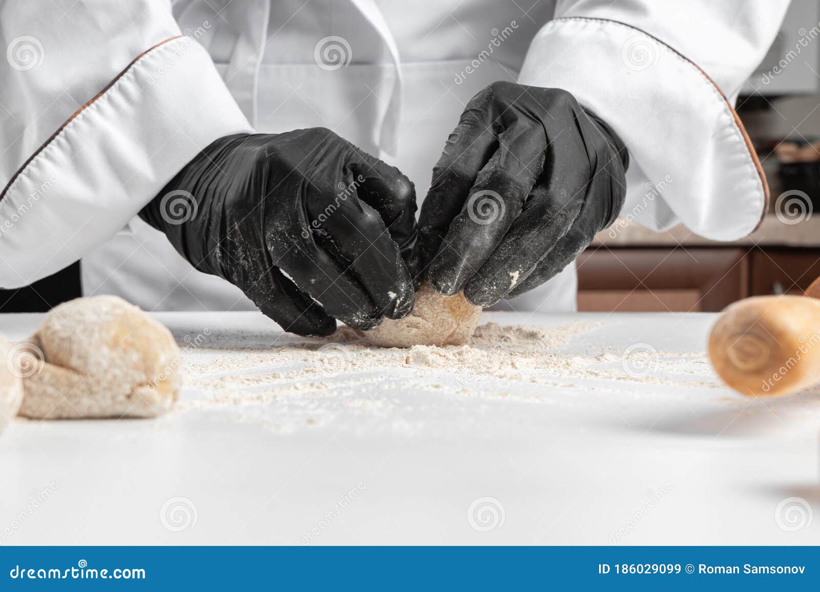 Chef in Blackgloved Hands Rolling Dough Balls Stock Image Image of