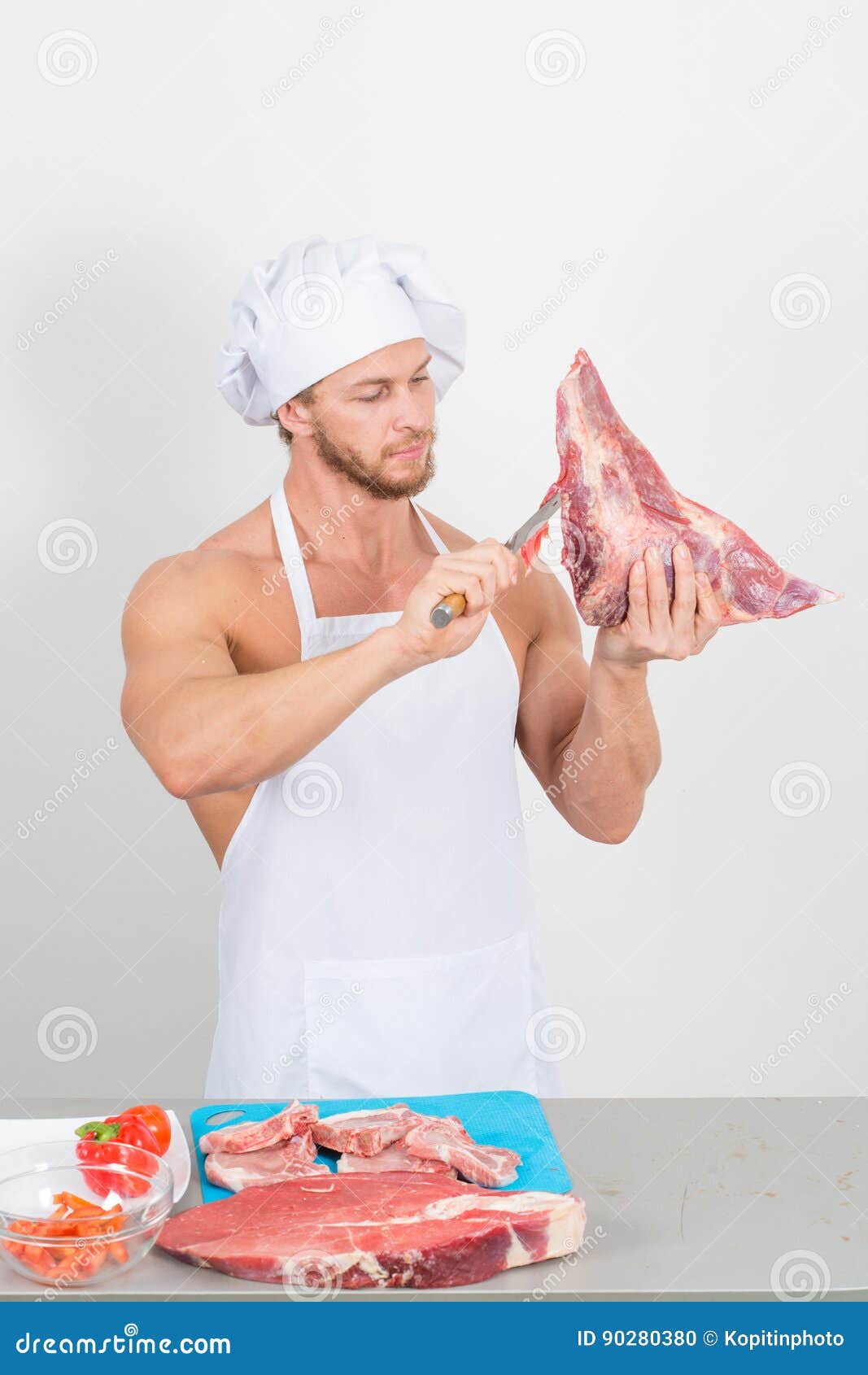 Chef Bodybuilder Preparing Large Chunks of Raw Meat. Natural Proteins