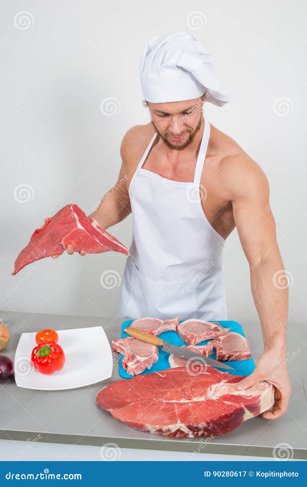Chef Bodybuilder Preparing Large Chunks of Raw Meat. Natural Proteins