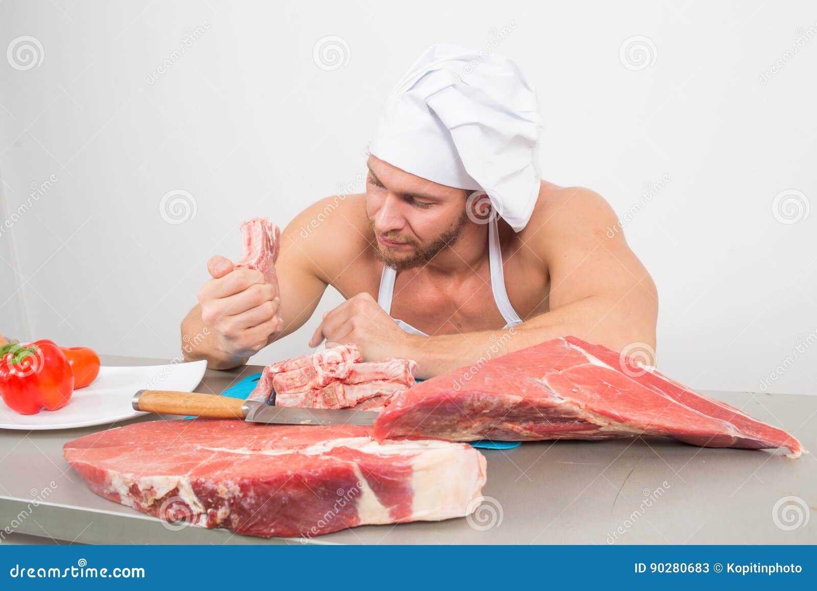 Chef Bodybuilder Preparing Large Chunks of Raw Meat. Natural Proteins