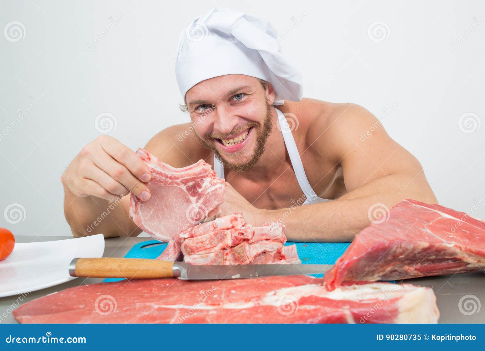 Chef Bodybuilder Preparing Large Chunks of Raw Meat. Natural Proteins