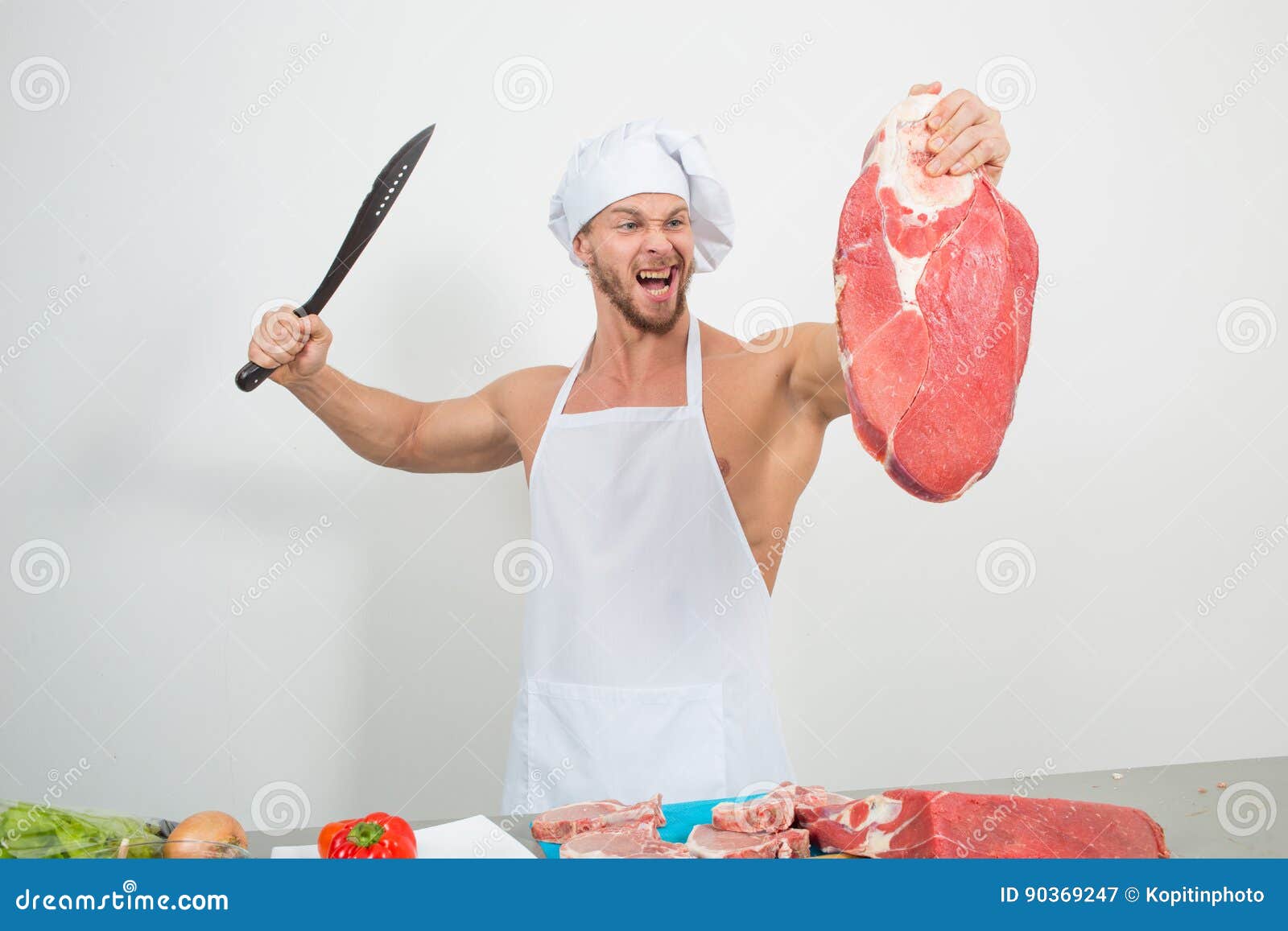 Chef Bodybuilder Preparing Large Chunks of Raw Meat. Natural Proteins