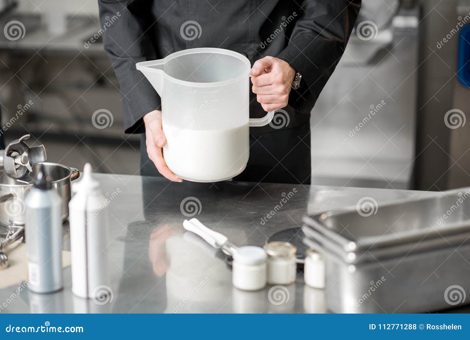 Chef cook with milk stock photo. Image of black, cook 112771288