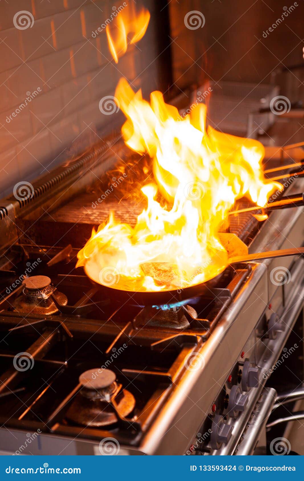 Chef Cooking with High Fire in Kitchen Stock Photo Image of fried, dinner 133593424