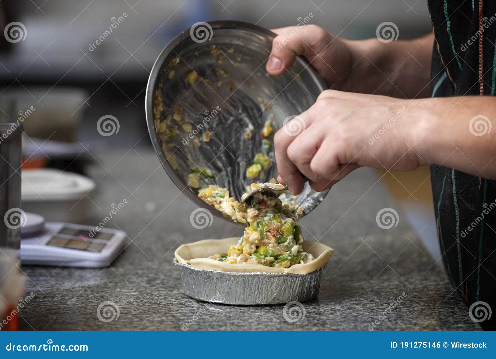 chef filling a vegetable tart
