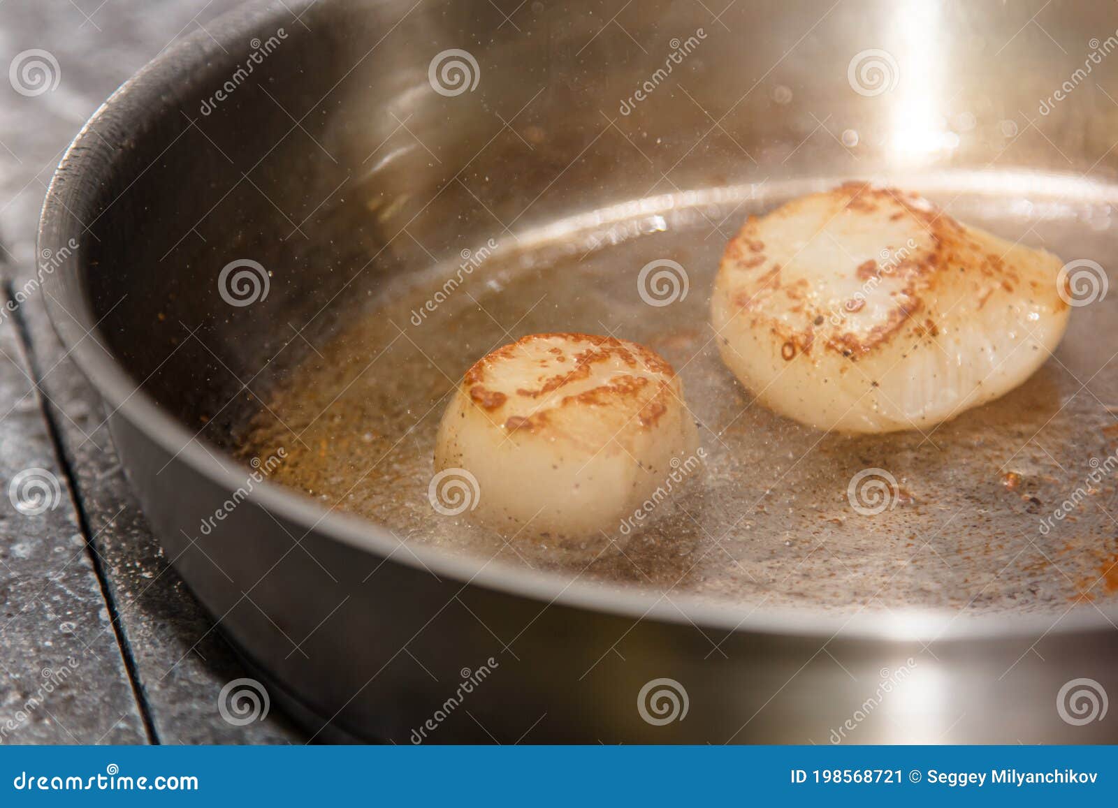 The Chef is Frying Scallops in Oil in a Frying Pan Stock Image Image