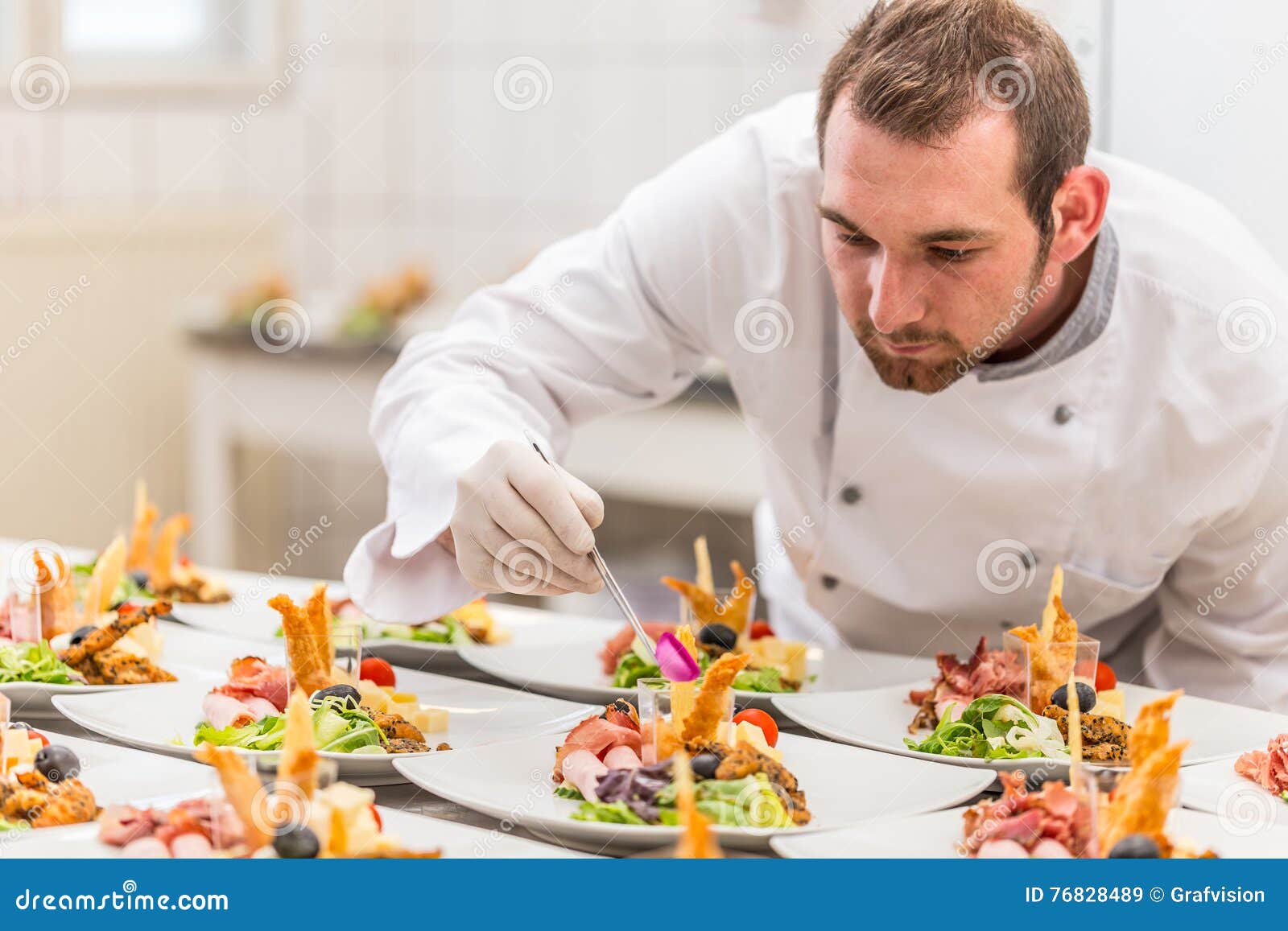 chef garnishing his appetizer plate