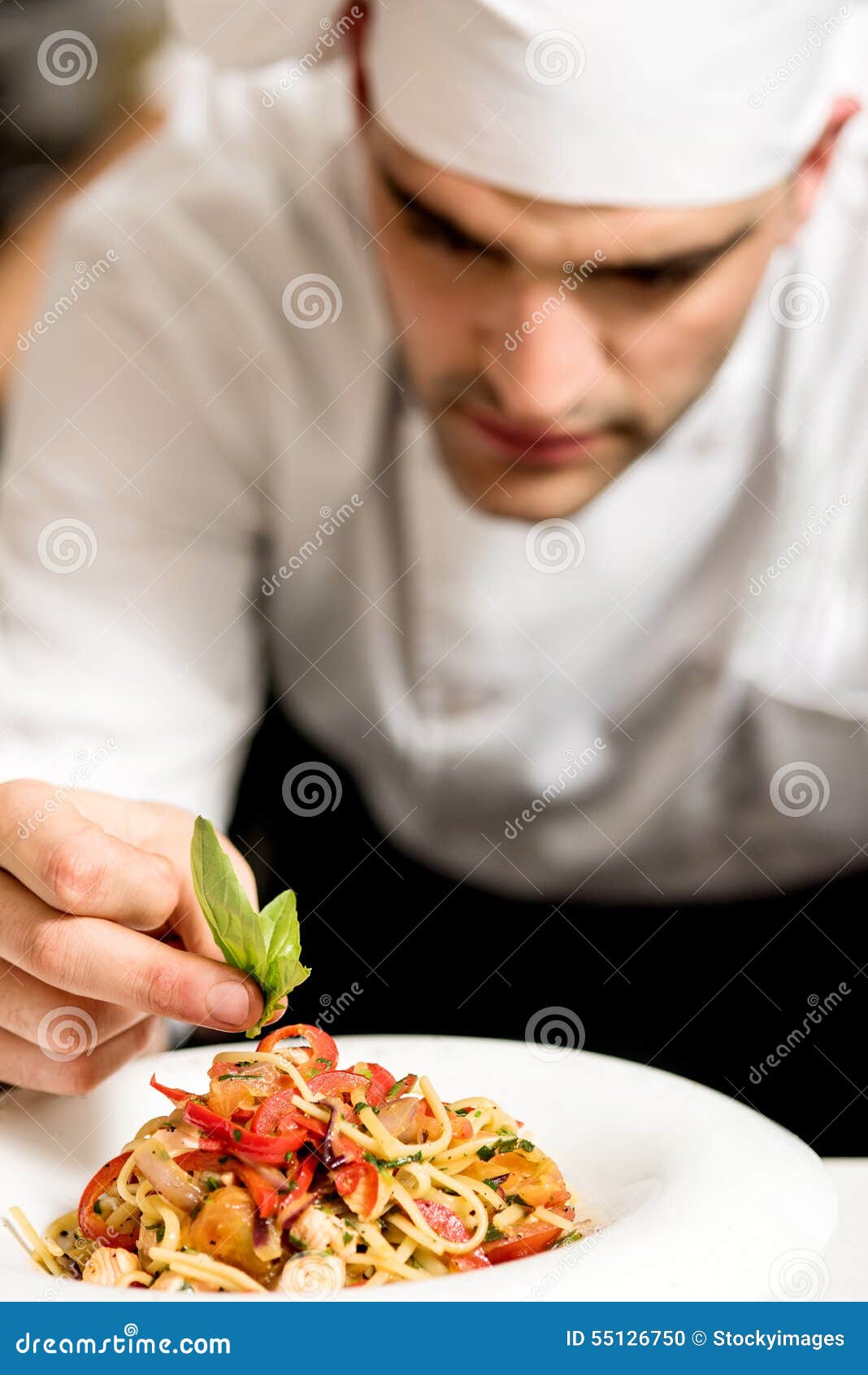 Chef garnishing pasta stock photo. Image of preparation - 55126750