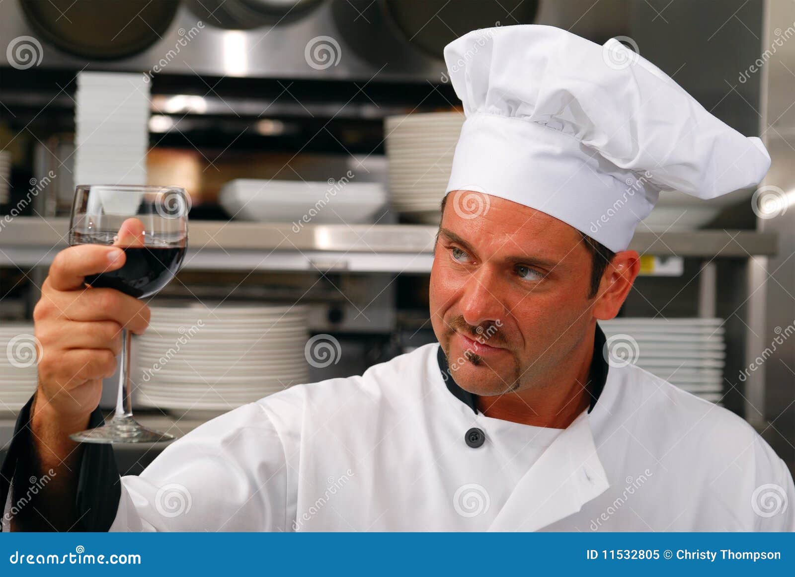 Chef with a glass of wine stock image. Image of handsome 11532805