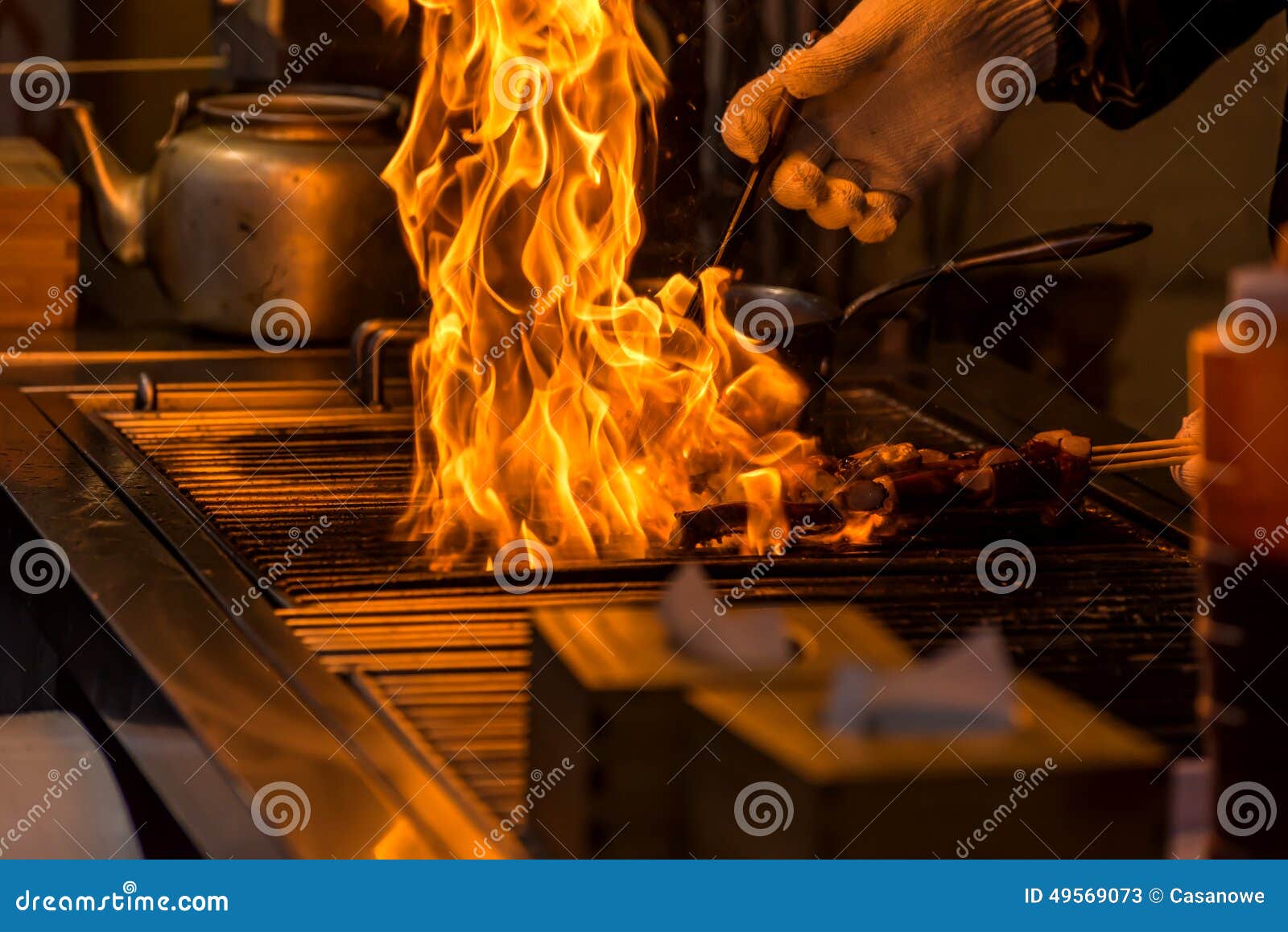 Chef Grilling Bbq with Flame of Burning in Restaurant Stock Image