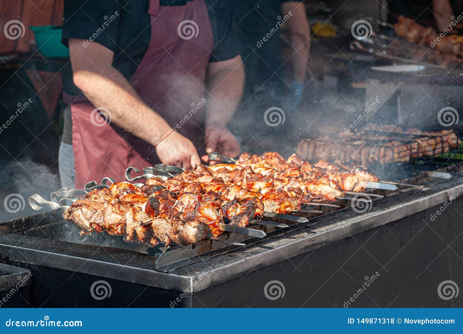 Chef Grills Meat Skewers on a Barbecue Grill in a Street Diner Stock Photo  - Image of outdoor, cooked: 149871318