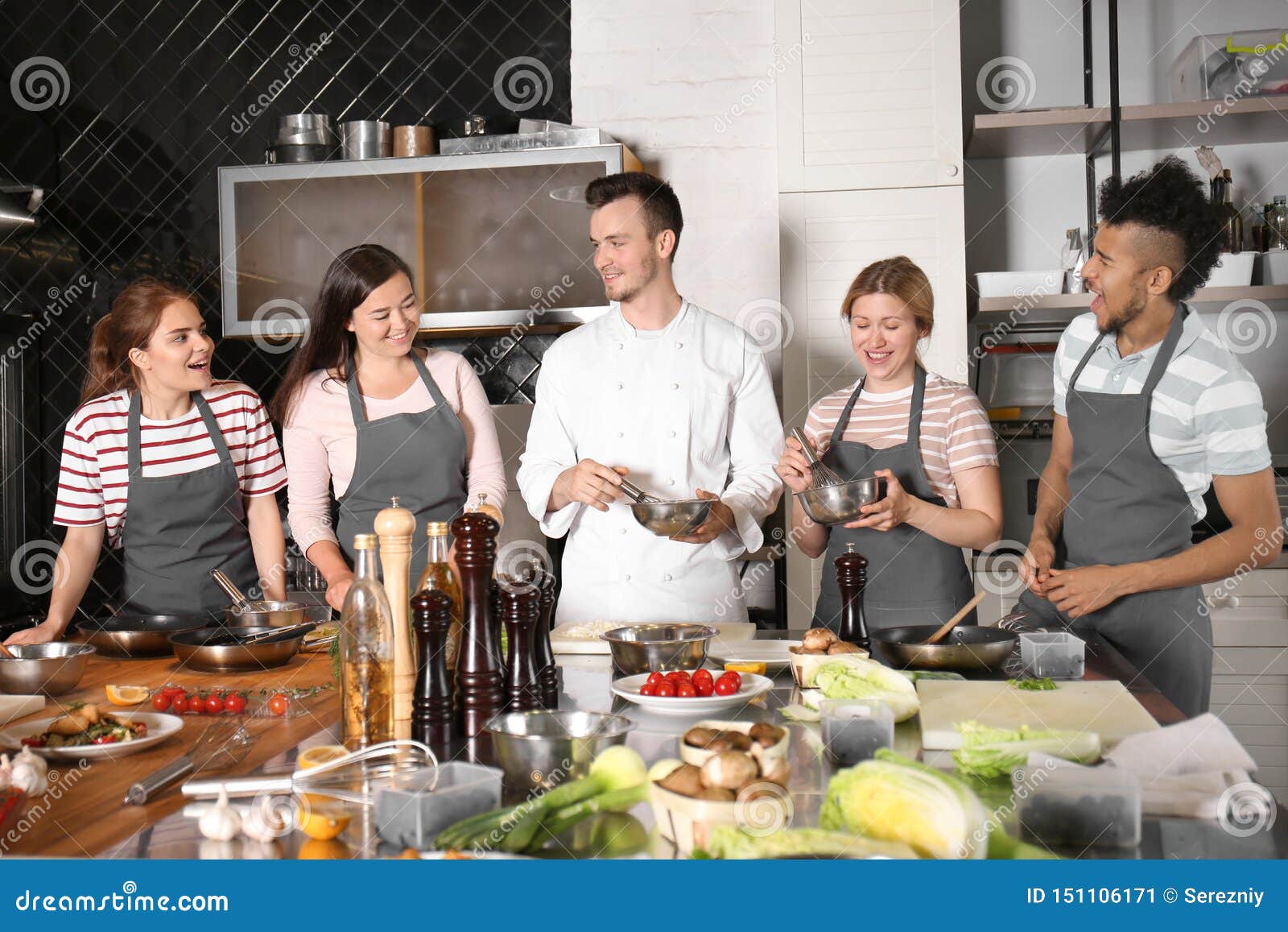 Chef and Group of Young People during Cooking Classes Stock Image