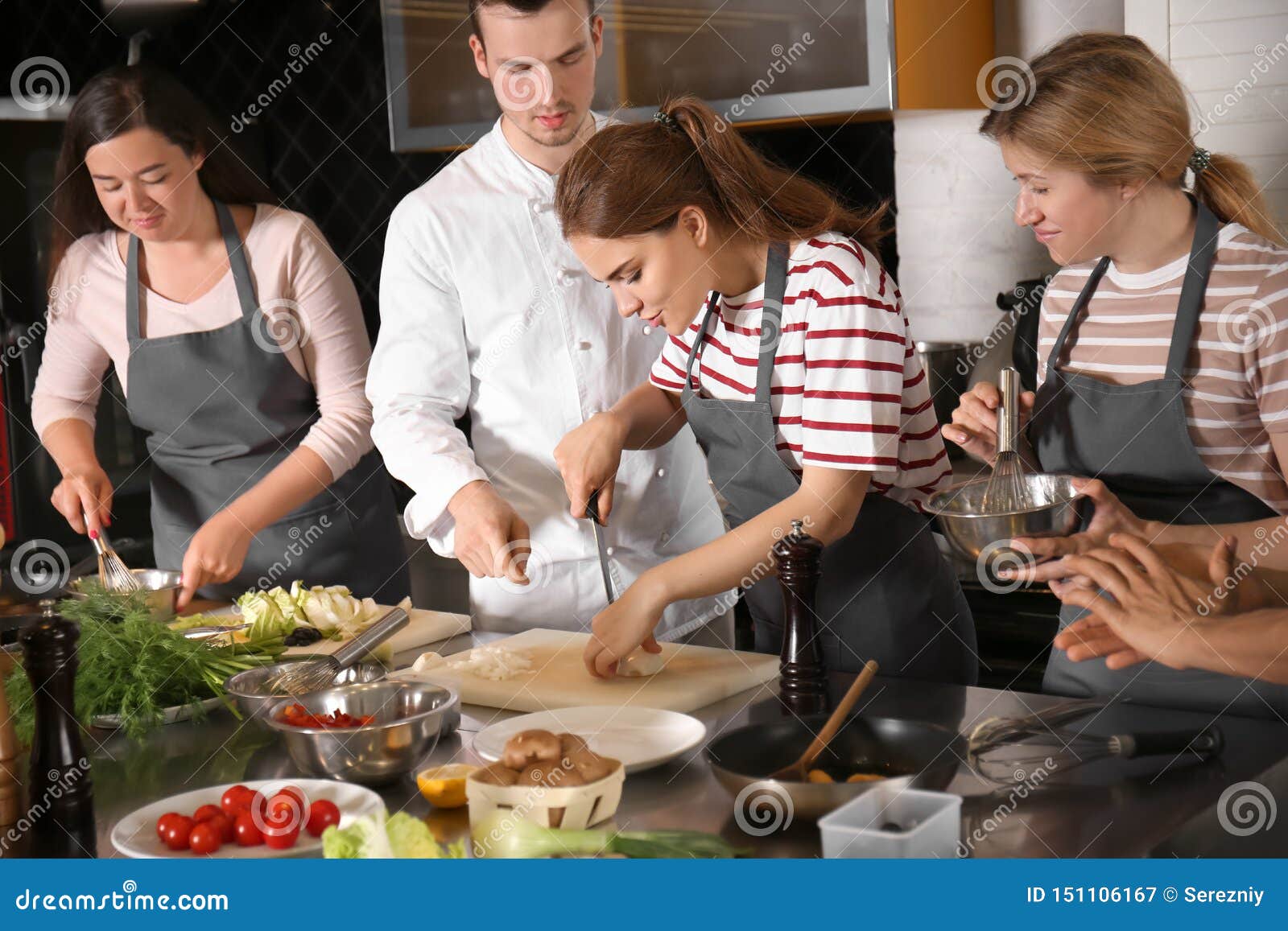 chef and group of young people during cooking classes