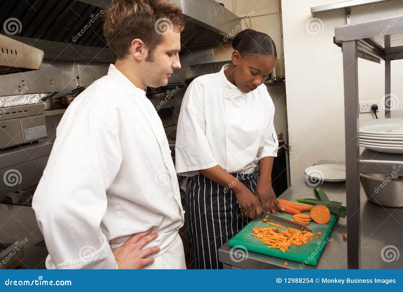 chef instructing trainee